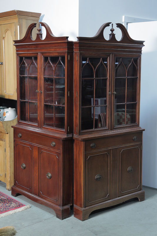 Appraisal: PAIR OF BRICKWEDE CORNER CUPBOARDS Mahogany having broken arch pediments