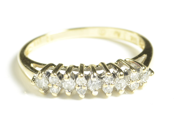 Appraisal: DIAMOND AND FOURTEEN KARAT GOLD RING set with round-cut diamonds