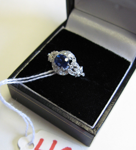 Appraisal: SAPPHIRE DIAMOND AND EIGHTEEN KARAT WHITE GOLD RING centering an