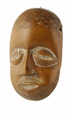 Appraisal: A Yoruba small mask with burnt simulated hair and beard