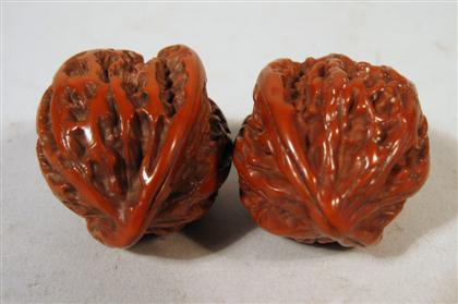 Appraisal: Pair of Chinese carved boxwood walnuts th th century Well-detailed