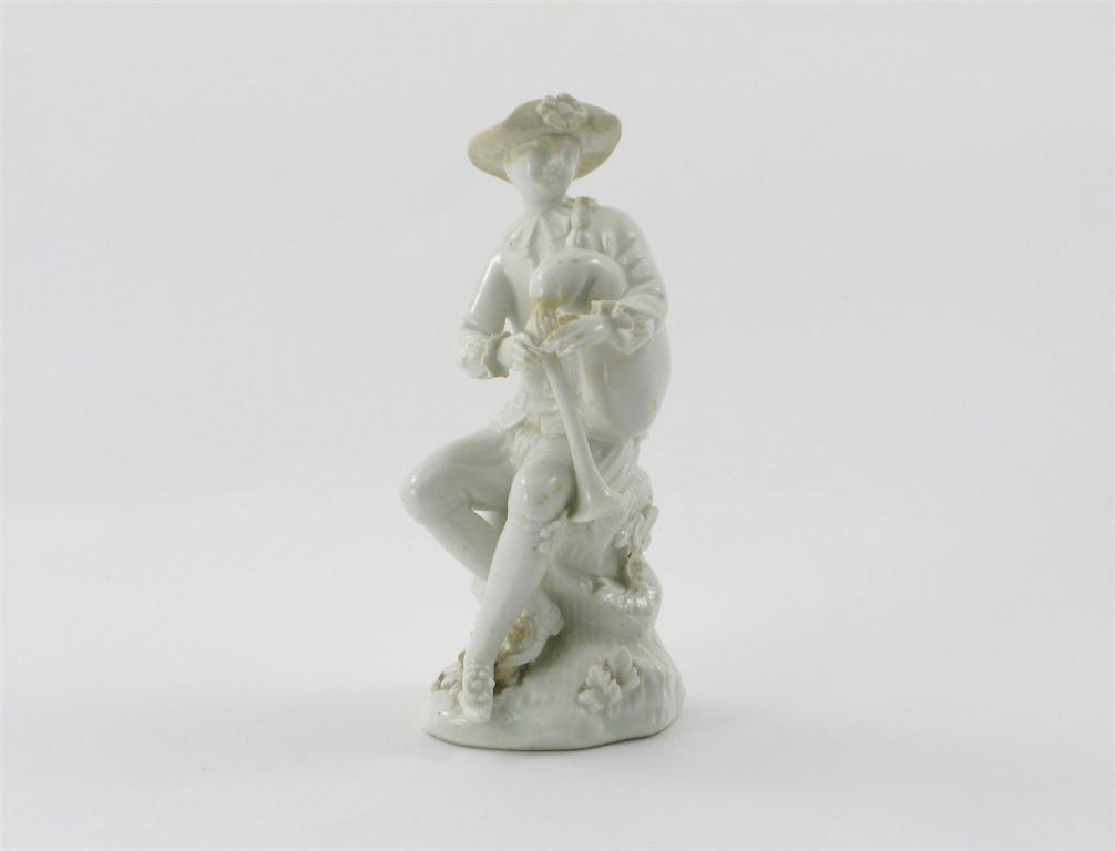 Appraisal: A Meissen white-glazed figure of a bagpipe player