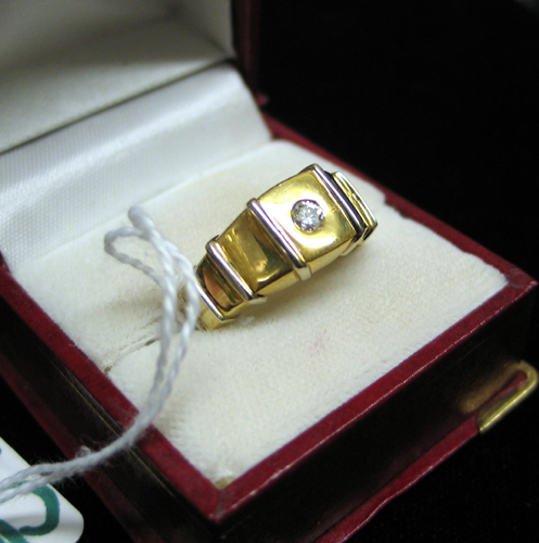 Appraisal: DIAMOND AND EIGHTEEN KARAT GOLD RING set with a single