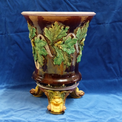 Appraisal: th century English majolica jardiniere on stand decorated with Oak