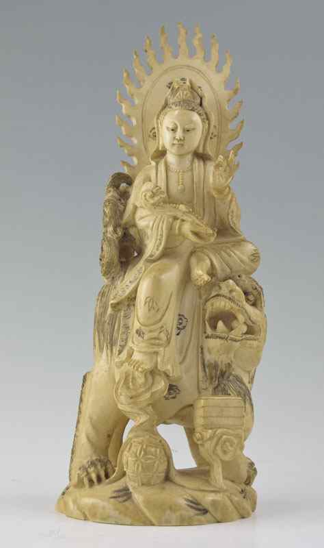 Appraisal: CARVED IVORY FIGURE OF QUANYIN th c inked ivory statue