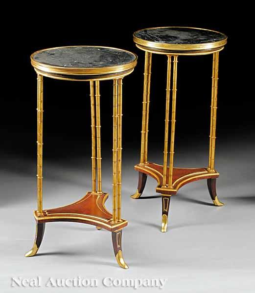 Appraisal: A Pair of Empire-Style Gilt Bronze and Mahogany Gu ridons