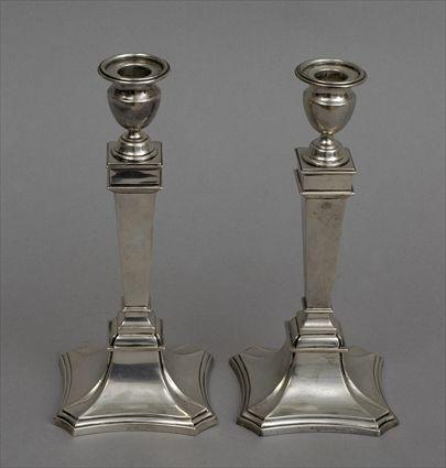 Appraisal: PAIR OF AMERICAN WEIGHTED SILVER TABLE CANDLESTICKS Each square tapered