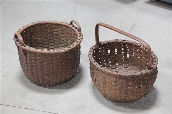 Appraisal: TWO BASKETS Splint woven baskets both with raised bottoms Round