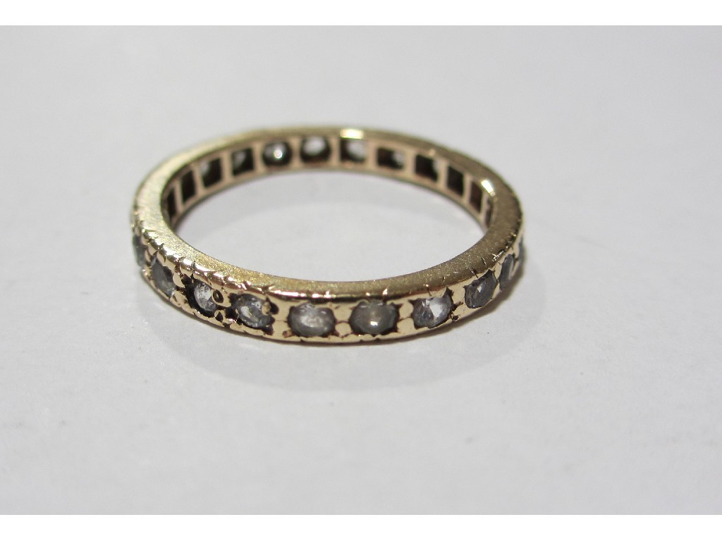 Appraisal: Yellow metal gem set full hoop eternity ring