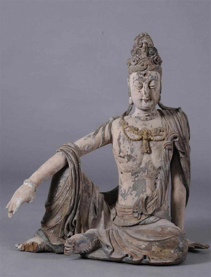 Appraisal: CHINESE POLYCHROME CARVED FIGURE OF A SEATED BODHISATTVA Wearing a