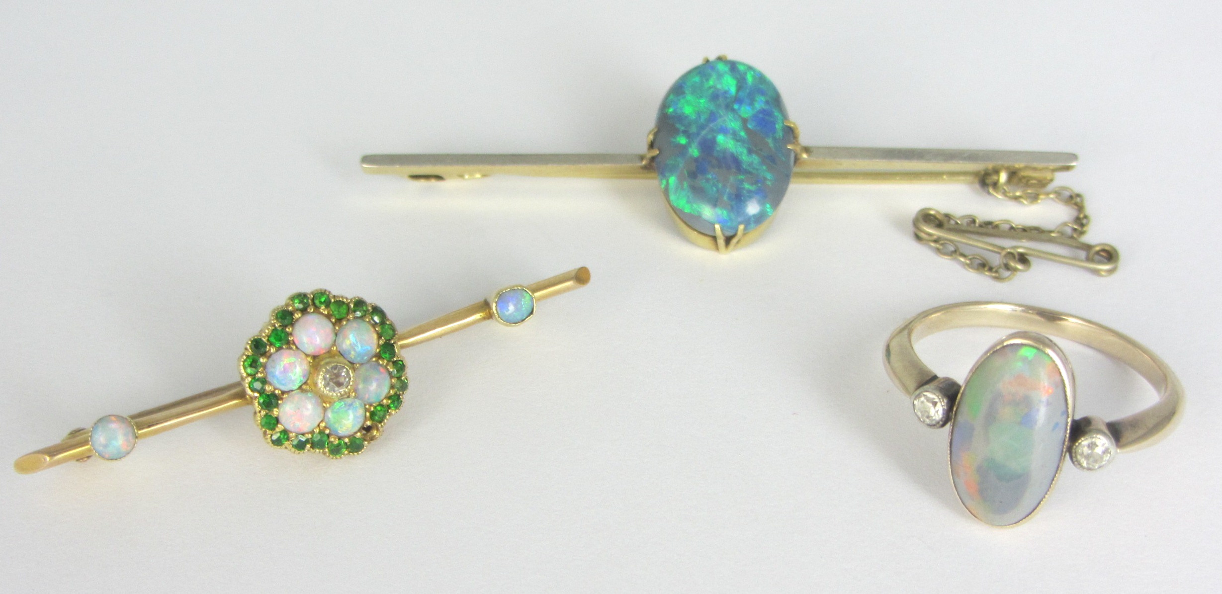 Appraisal: A gold diamond demantoid garnet and opal set cluster bar