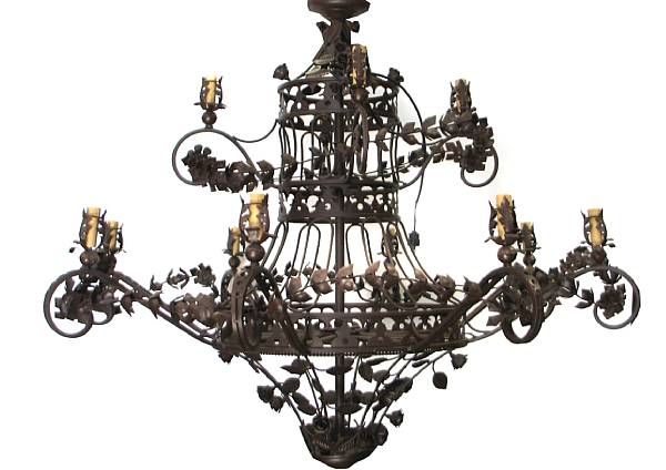 Appraisal: A large patinated wrought metal twelve light chandelier height ft