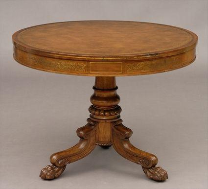 Appraisal: REGENCY BRASS-INLAID AND CARVED ROSEWOOD TILT-TOP DRUM TABLE The gold-tooled