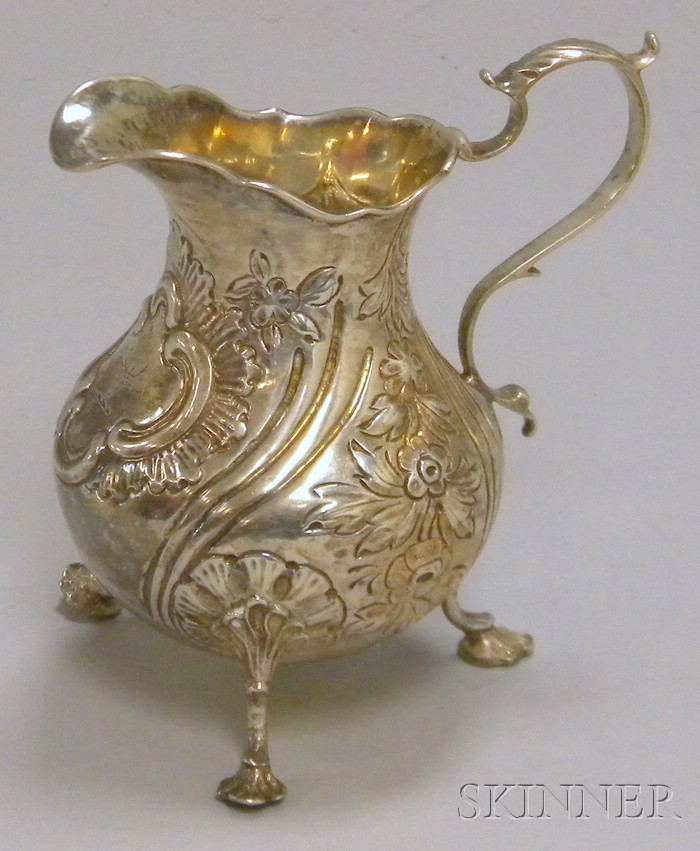 Appraisal: Victorian Silver Creamer London with repousse decoration repair at join