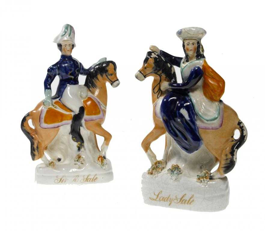 Appraisal: A PAIR OF STAFFORDSHIRE EARTHENWARE EQUESTRIAN PORTRAIT FIGURES OF SIR