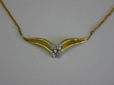 Appraisal: A DIAMOND NECKLACE having ct gold V panel set with