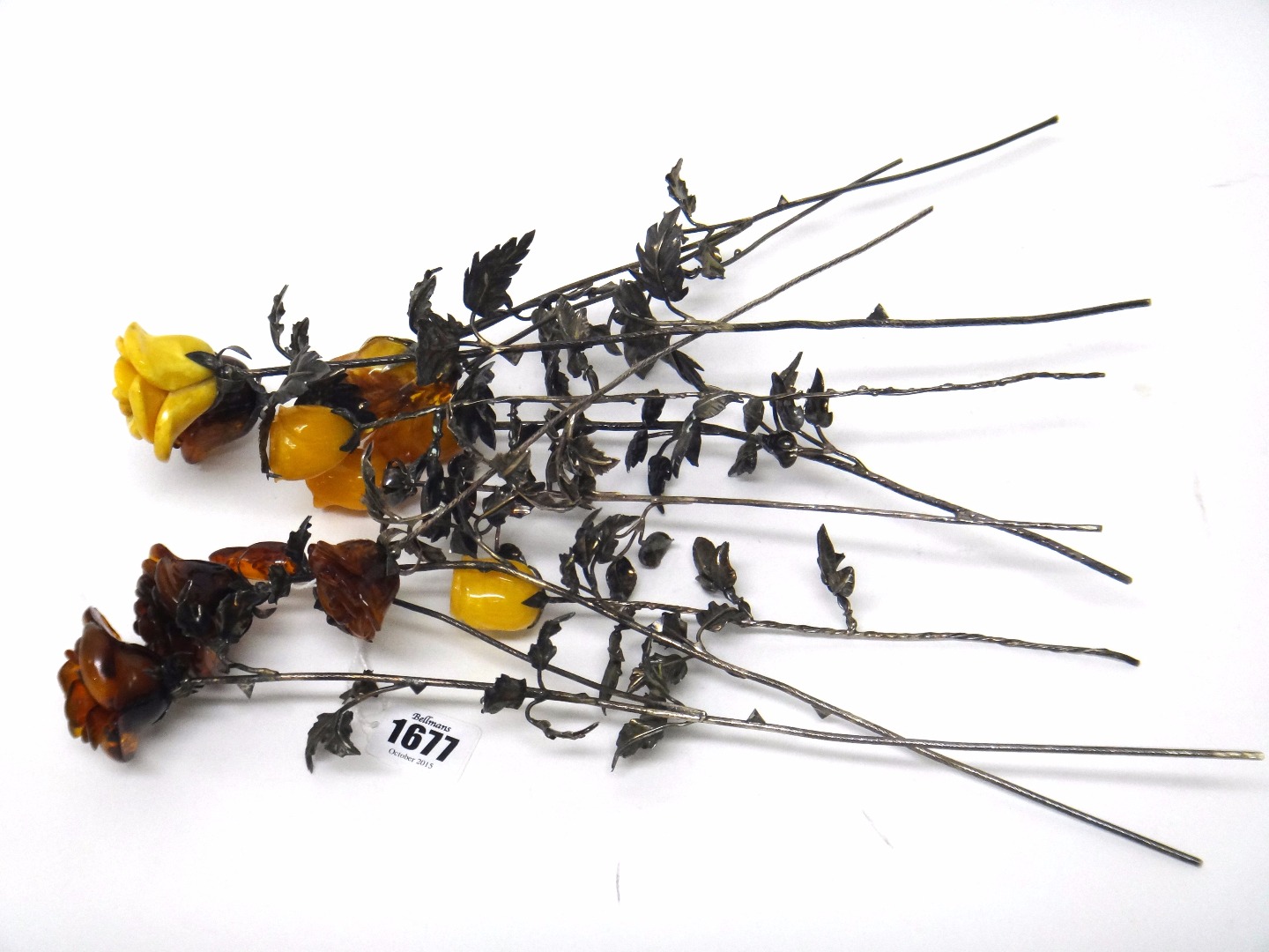 Appraisal: A group of ten silver and reconstituted amber naturalistic models