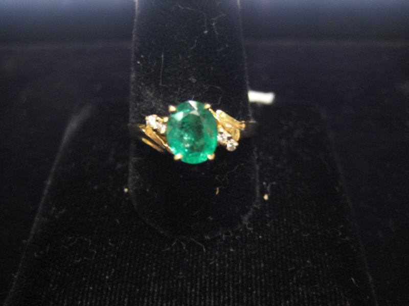 Appraisal: EMERALD AND DIAMOND RING Lady's k yellow gold ring set