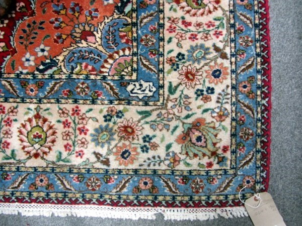 Appraisal: A Tabriz carpet Persian the burgundy field with an orange