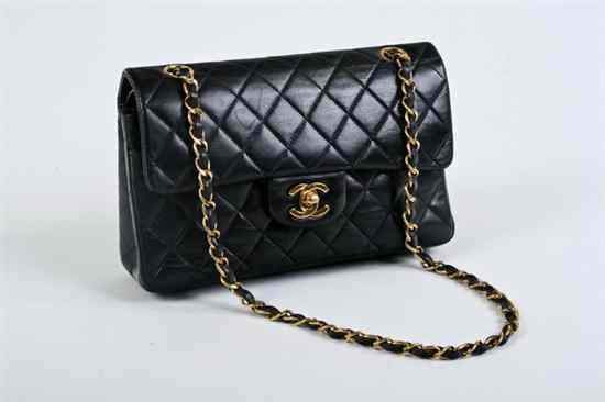 Appraisal: CHANEL BLACK QUILTED LEATHER HANDBAG Interior fitted with two compartments