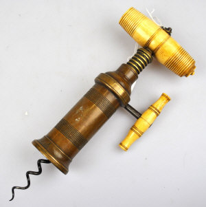 Appraisal: Bronze and bone handled barrell rachet King's pattern corkscrew applied