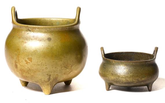 Appraisal: TWO SMALL BRONZE INCENSE BURNERS China th c height and