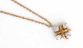 Appraisal: An ct gold and platinum 'Lynn' four diamond set pendant