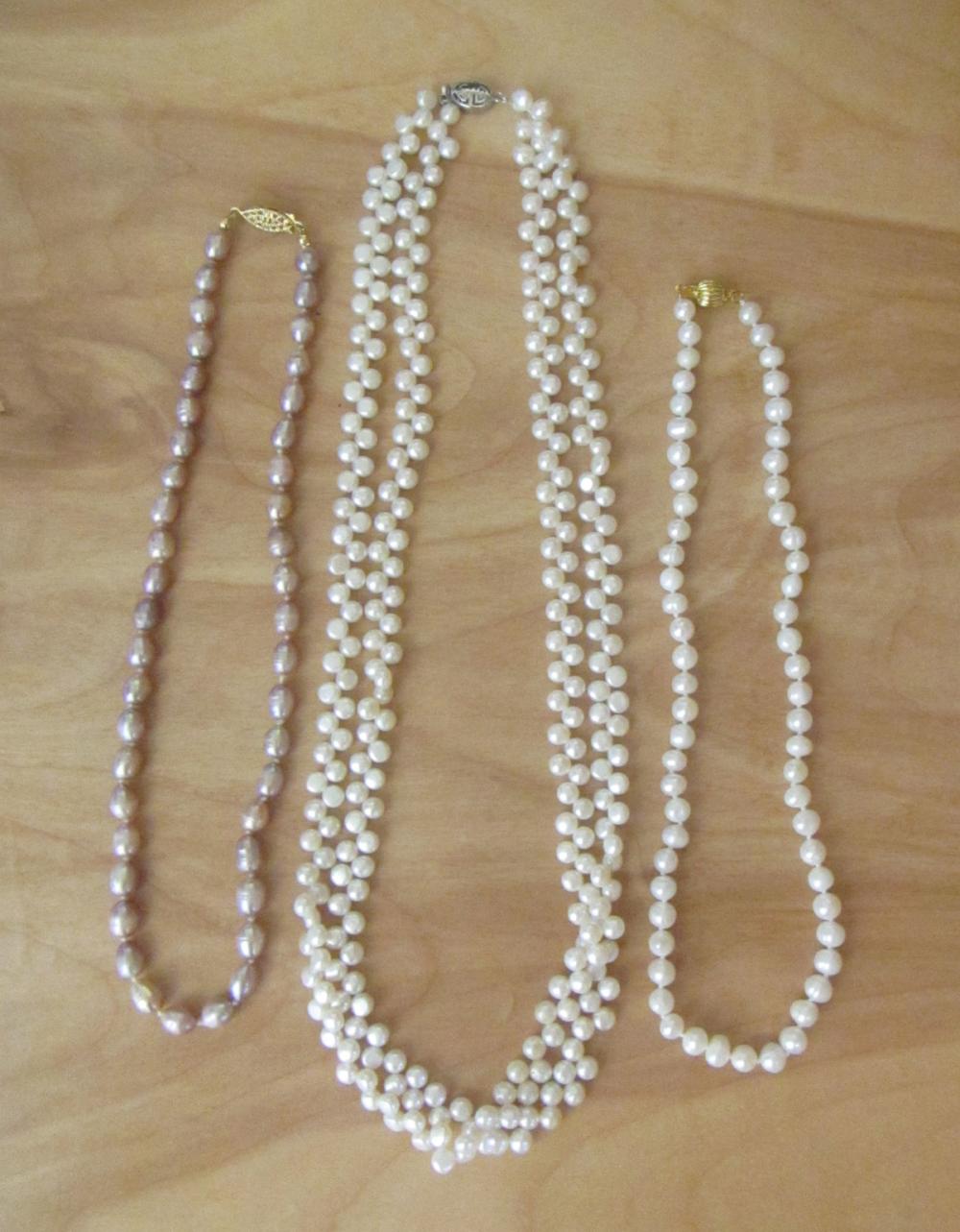 Appraisal: THREE FRESHWATER PEARL NECKLACES including an single strand of white