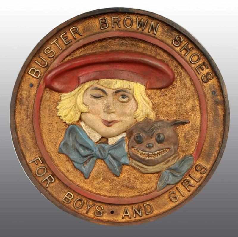 Appraisal: Cast Iron Buster Brown Shoes Wall Plaque Description All original