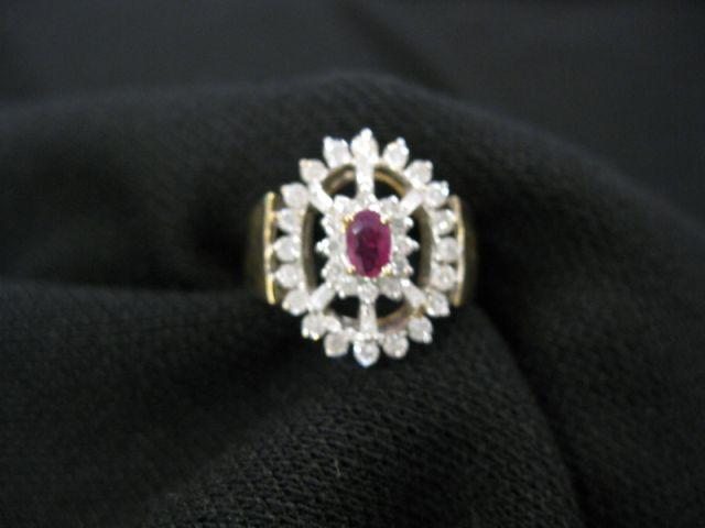 Appraisal: Ruby Diamond Ring oval ruby surrounded by round and baguette