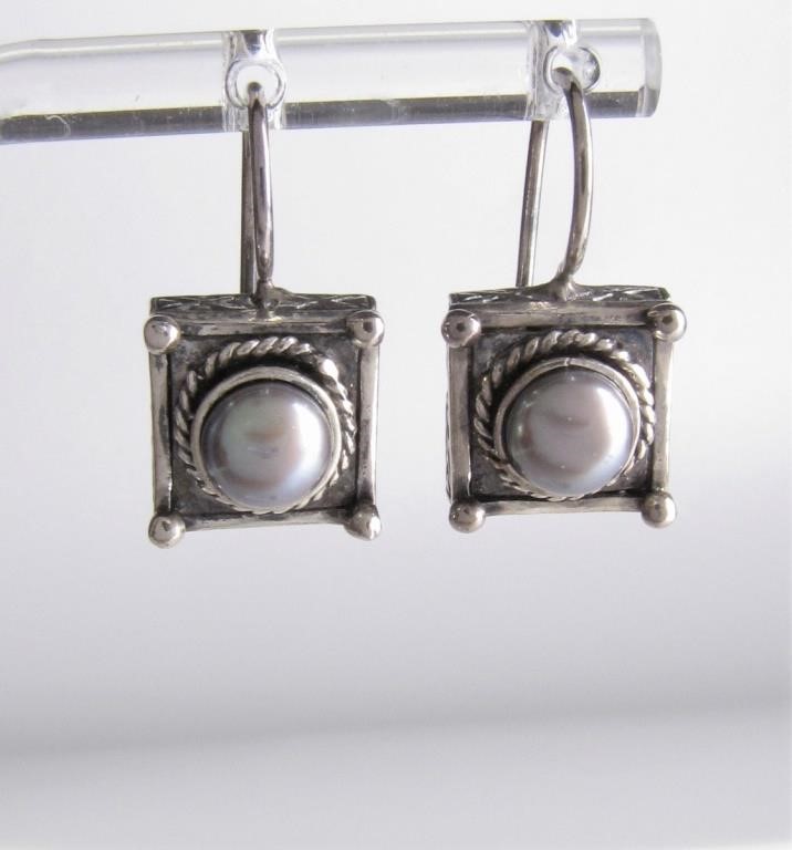 Appraisal: A pair of sterling silver earrings by Anatoli each with