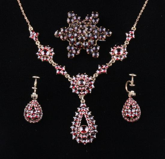 Appraisal: THREE PIECES GARNET CLUSTER JEWELRY Floral design pendant necklace suspending