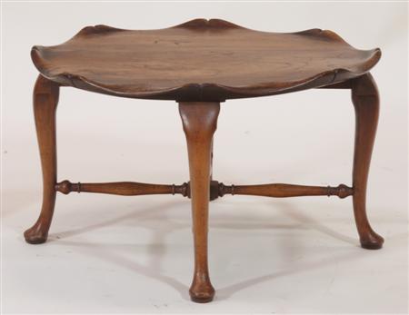 Appraisal: An Aesthetic oak circular table the shaped lipped top raised