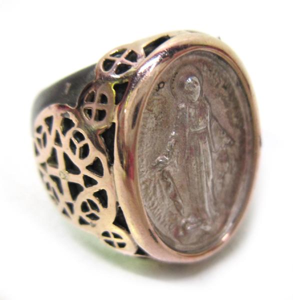 Appraisal: A VIRGIN MARY RING IN TITANIUM AND GOLD A VIRGIN