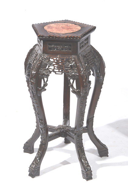 Appraisal: A CHINESE HARDWOOD URN STAND with polygonal top inset rose