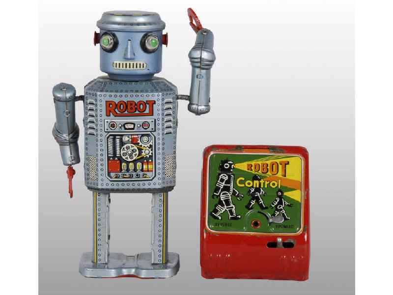 Appraisal: Japanese Tin Battery-Operated R- Robot Toy Description Working Eyes light