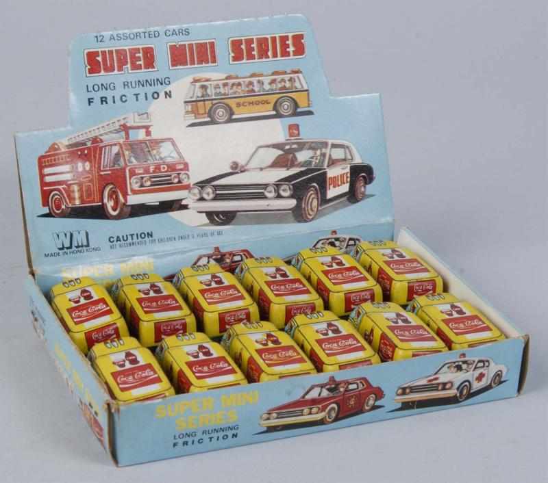 Appraisal: Boxed Set of Super Mini Coca-Cola Toy Trucks Description Light