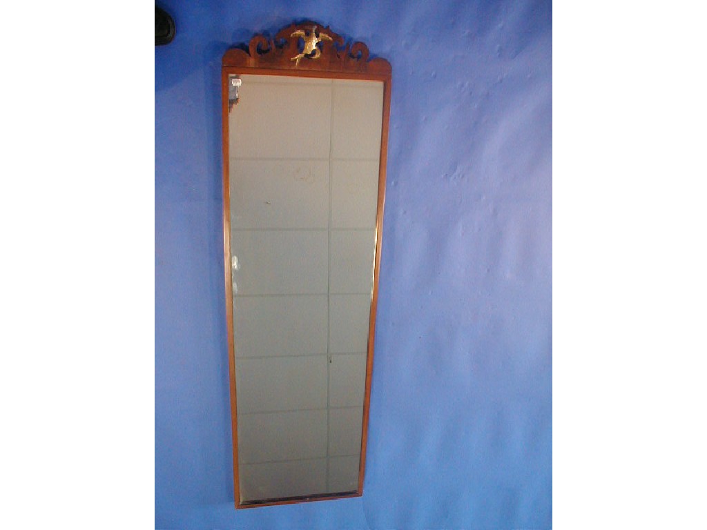 Appraisal: A full length dressing mirror with applied ho-ho bird pediment