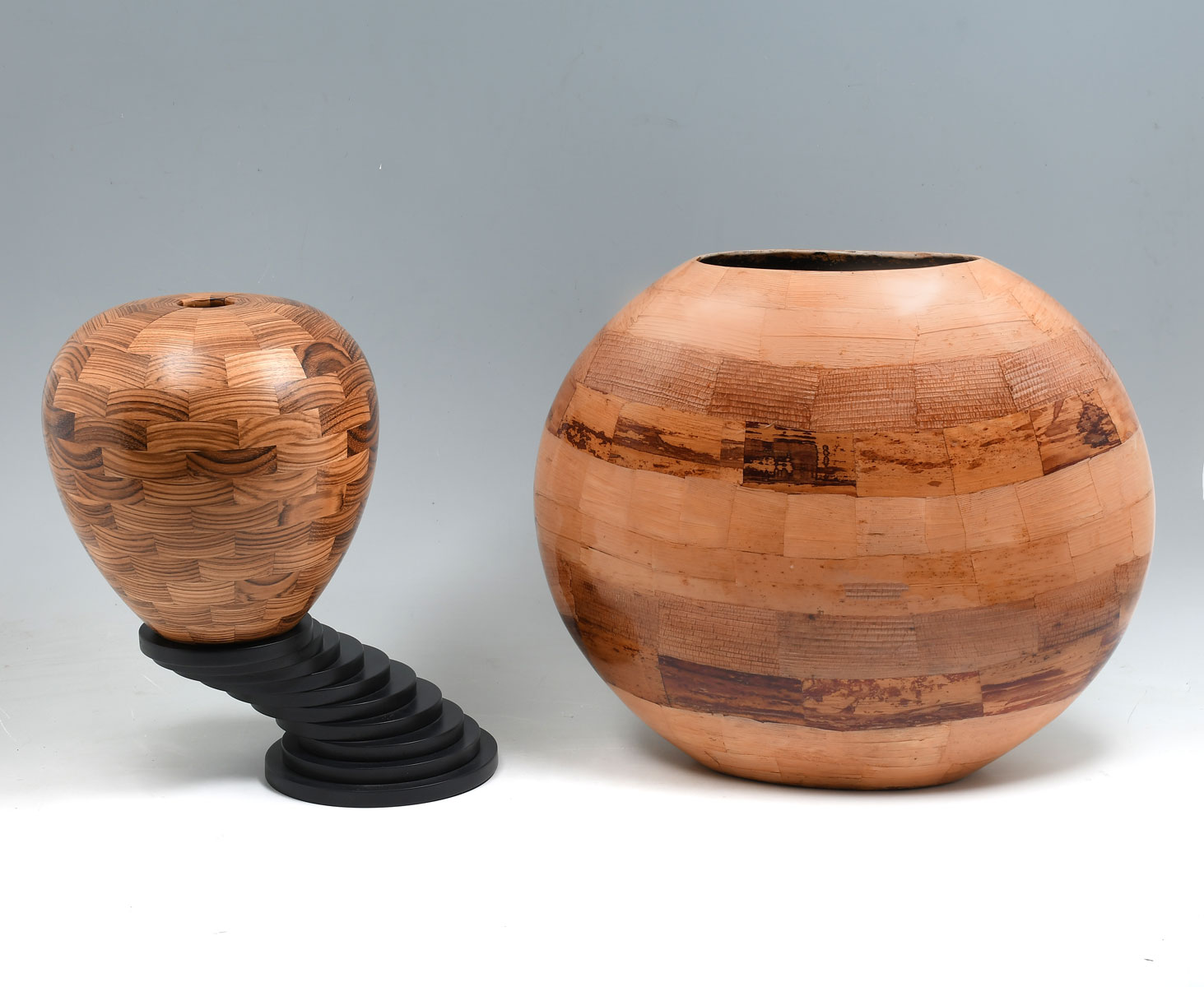 Appraisal: PIECE SEGMENTED WOOD VASES Comprising - Elongated segmented wood vase