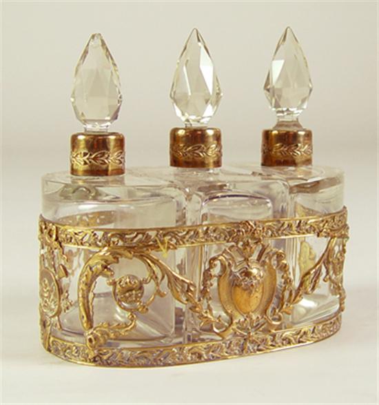 Appraisal: Triple Perfume Bottle Set in Gilt Caddy Late 's early