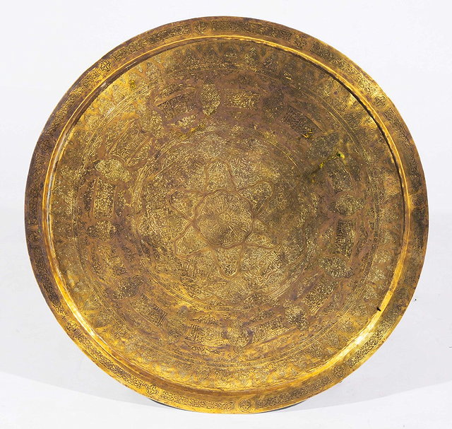 Appraisal: A KAJAR BRASS ENGRAVED LARGE TRAY with radiating concentric Arabic