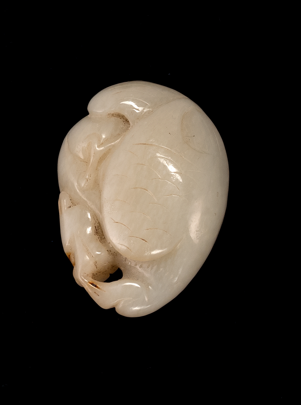 Appraisal: WHITE JADE PENDANT Circa Depicting a hawk and a lion