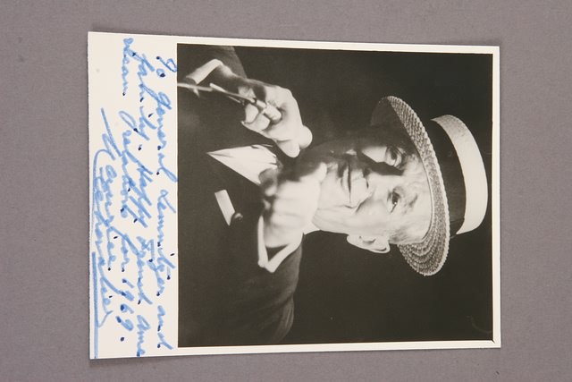 Appraisal: Autographed photograph of bust view of Chevalier at microphone Inscription