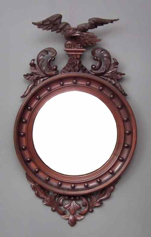 Appraisal: A th Century mahogany framed circular convex wall mirror of