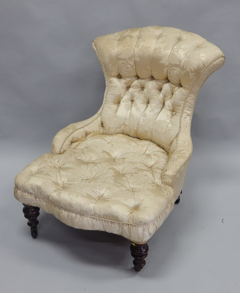 Appraisal: A Victorian mahogany nursing chair elaborately upholstered in gold coloured