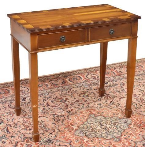 Appraisal: English style table thc having a banded rectangular top over