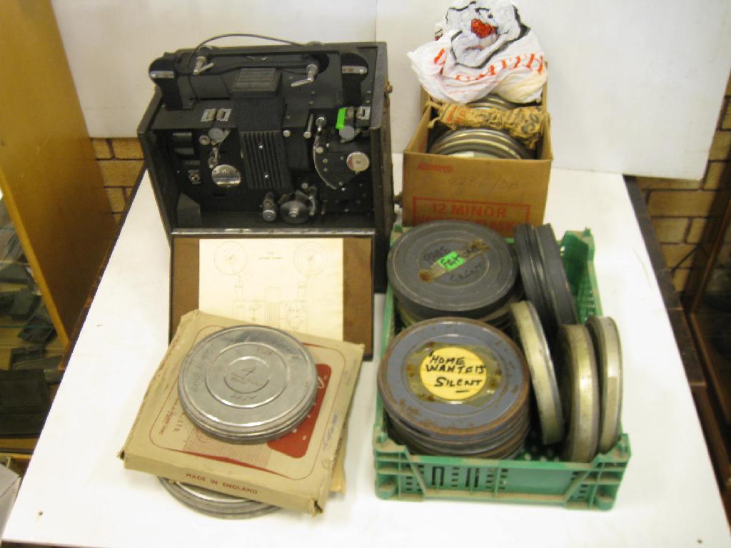 Appraisal: A mm Film Projector and various Films in cannisters