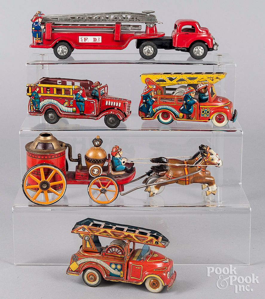 Appraisal: Four Japanese tin litho friction fire trucks Four Japanese tin