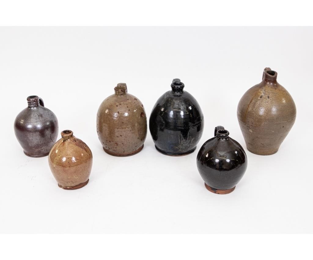 Appraisal: Six stoneware redware ovoid jugs th c the largest marked