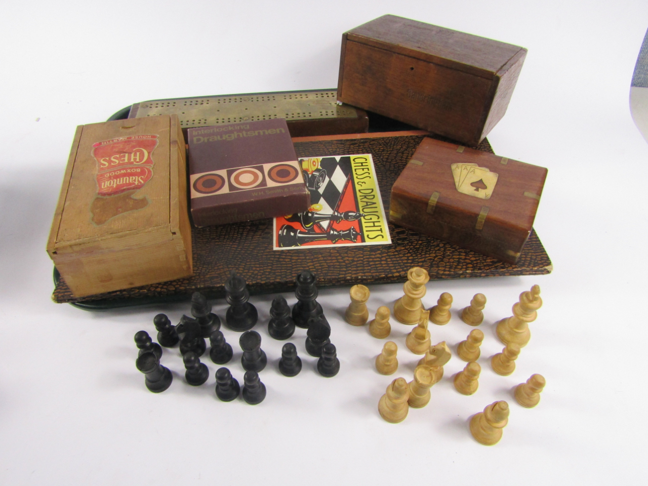 Appraisal: A Staunton wooden chess set boxed two boxes of draughts